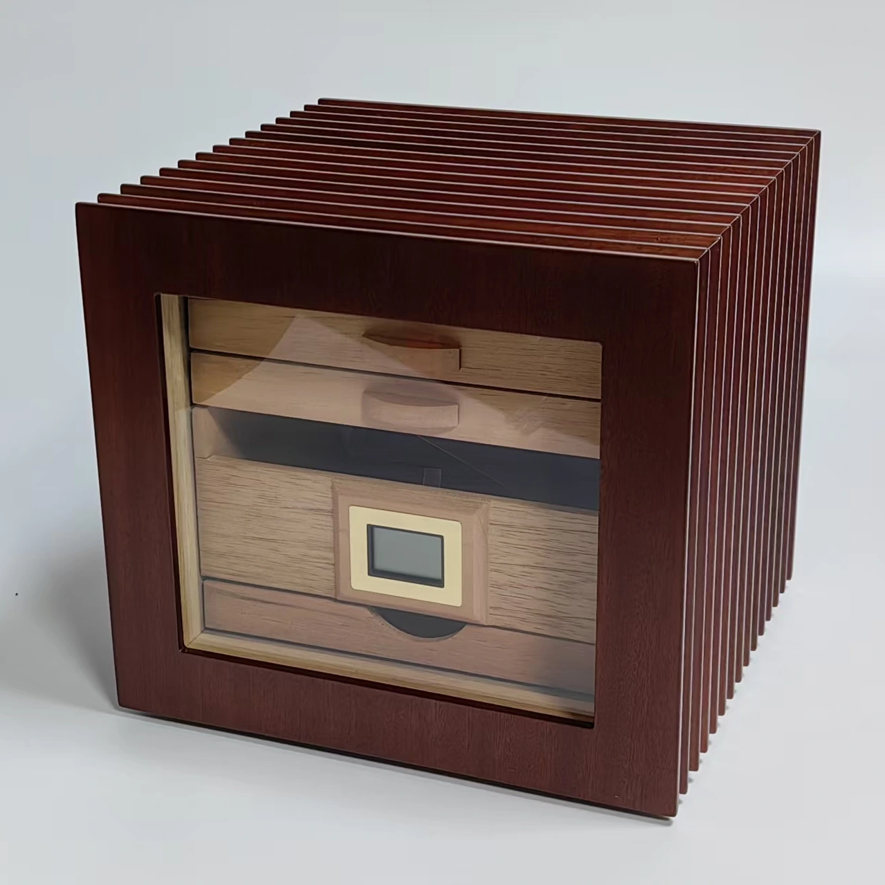 Cedar cigar humidor with a glass door, wooden drawers, digital hygrometer and ribbed exterior.